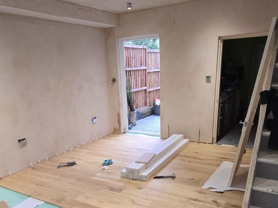 Engineered oak flooring being laid by GS Renovation in a newly plastered room