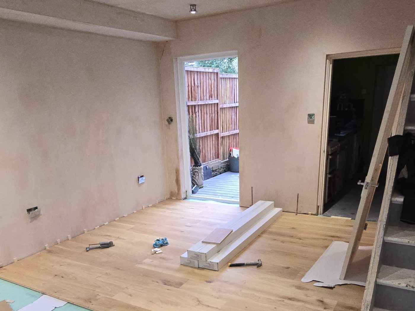 Engineered oak flooring being laid by GS Renovation in a newly plastered room