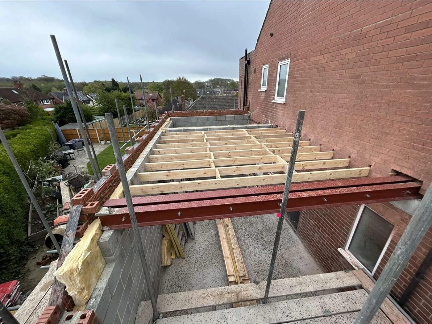 Steel and new floor joists set out on a rear extension built by GS Renovation at a UK home