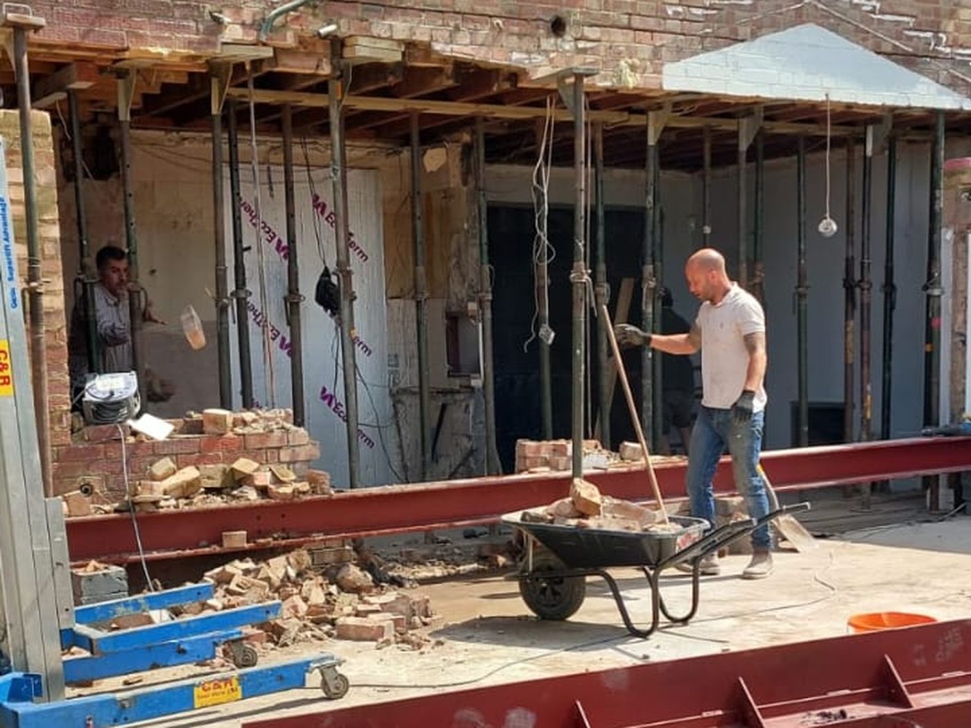 Steel beams laid out and installed across a rear elevation on a GS Renovation structural job