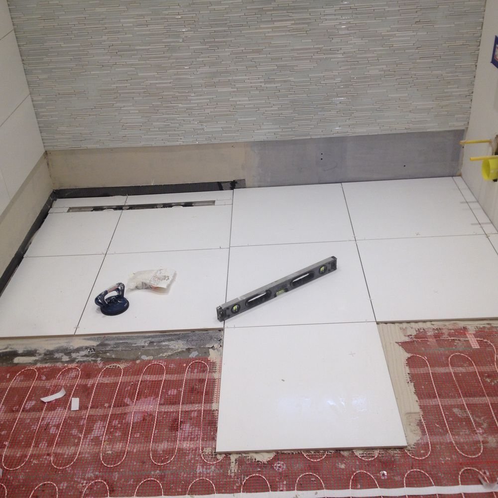 Underfloor heating and floor tiling by GS Renovation, London